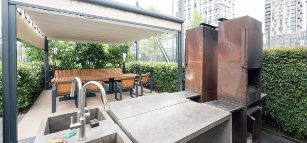 back yard with outdoor seating and barbecue with family . High quality photo